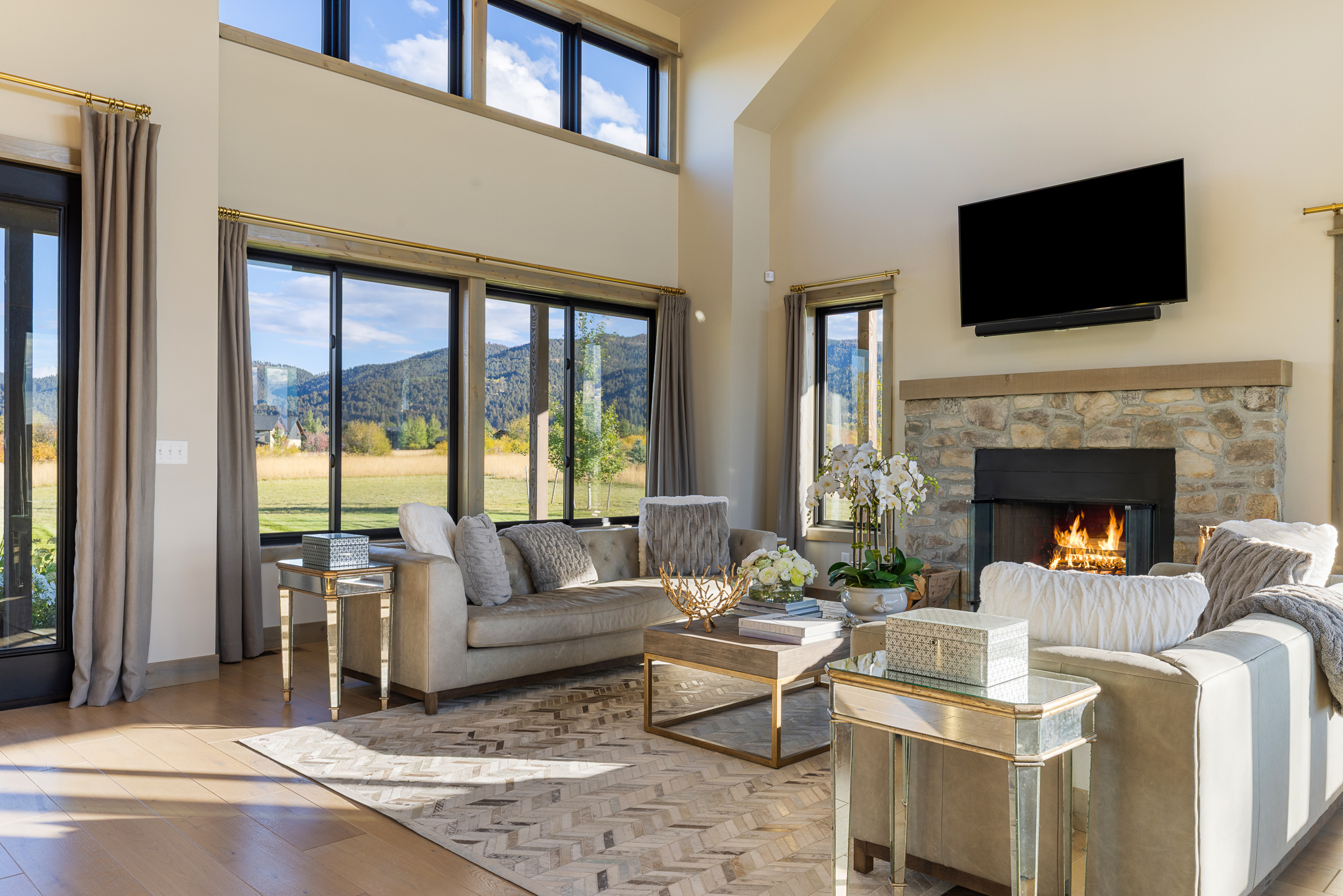 58 Waylon Way, Bozeman, MT, Bozeman luxury home at 58 Waylon Way in Home 40 featuring vaulted ceilings, stone fireplace, and mountain views